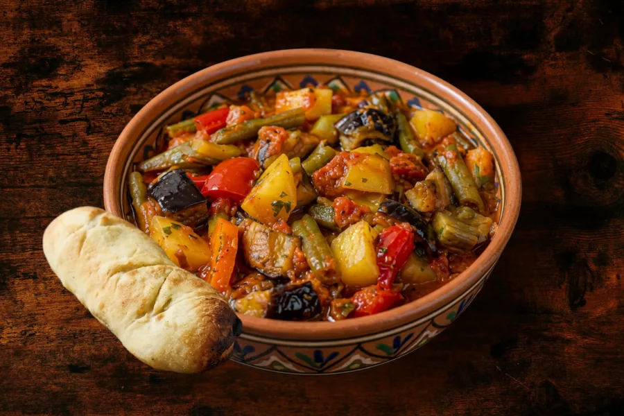 Meatless vegetable stew with freshly baked flatbread